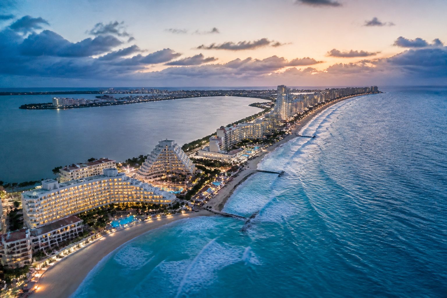 Aerial view of Cancun's turquoise Caribbean coastline and beachfront hotels along the Yucatán Peninsula, Mexico